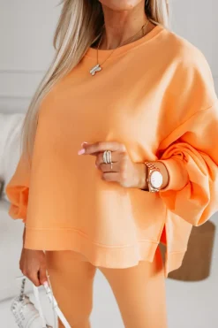 BLUZA BAWEŁNIANA MERRY OVERSIZE ASYMETRYCZNA Z ROZCIĘCIAMI PO BOKACH POMARAŃCZOWA