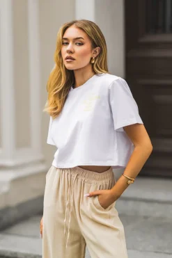 T-SHIRT BAWEŁNIANY Z PODUSZKAMI NA RAMIONACH Z NAPISEM BIAŁO-ŻÓŁTY